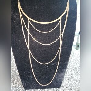 Goldtone fashion necklace, multi teared, draping necklace, with hammered plate